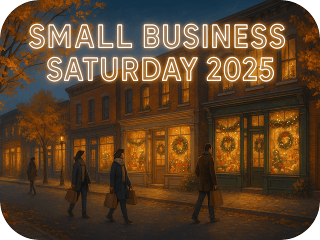 Small-town main street at twilight with glowing Christmas storefronts, golden autumn leaves, and bundled shoppers walking with shopping bags beneath the bright header text “Small Business Saturday 2025.”