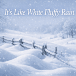 Wind-sculpted snow drifts curve around a fence and bare trees as light snow falls across a quiet winter landscape.