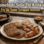 A hearty winter lunch of crispy scrapple and browned kielbasa served with mustard, pickles, and rustic bread on a wooden table, with a warm cast-iron skillet nearby in cool January daylight.