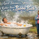 Man enjoying a steaming outdoor bubble bath in light spring rain while a disapproving woman looks on, with playful text reading “April Showers? I’d Rather Have A Bubble Bath.”