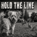 Black-and-white 1940s-style scene of Rose, a shaggy Yorkie mix, standing proudly in a June lawn while several unconcerned rabbits graze and play beneath the headline “Hold The Line.”