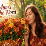 Kelly smells a lush pot of autumn-colored mums in warm September sunlight.